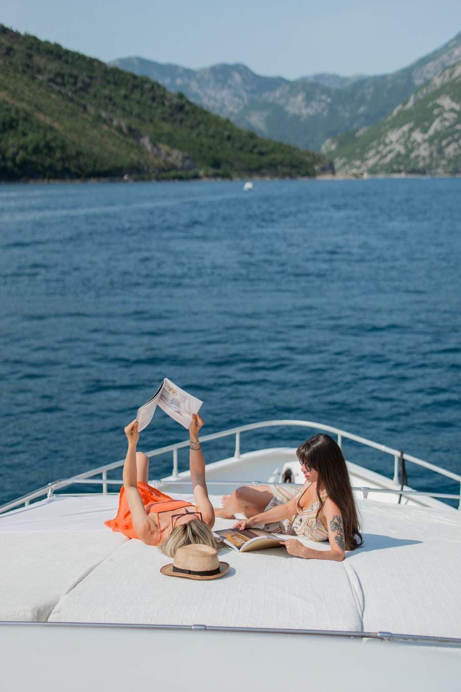 The sundeck of Marea with the bay beyond the rail